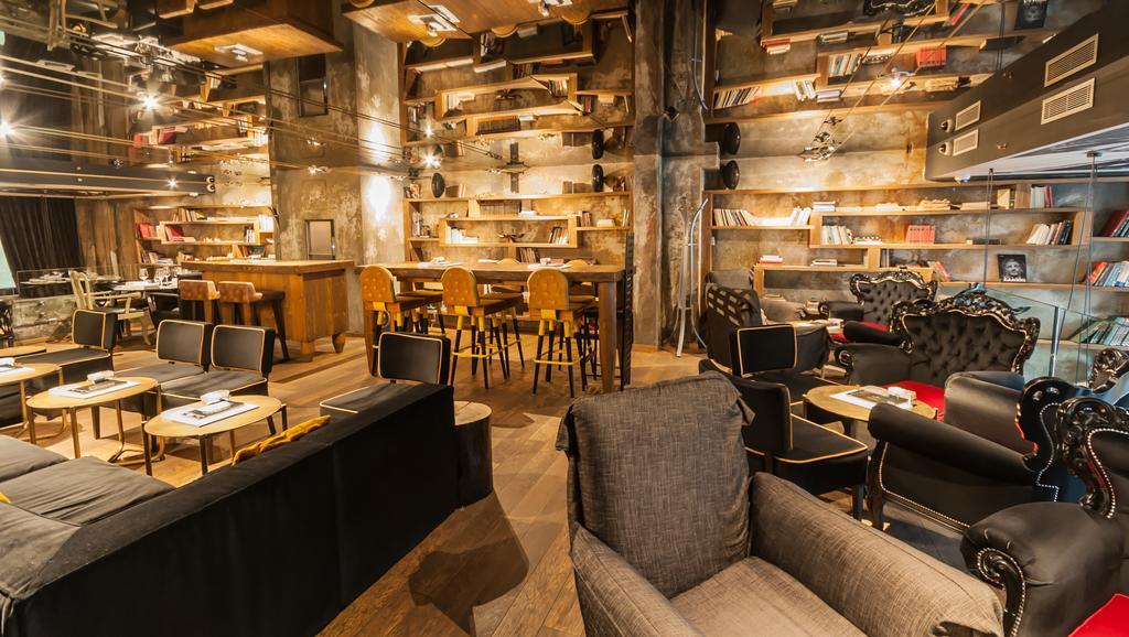 Hotel Hemera Подгорица Экстерьер фото Interior of a Starbucks Reserve store in Milan, Italy