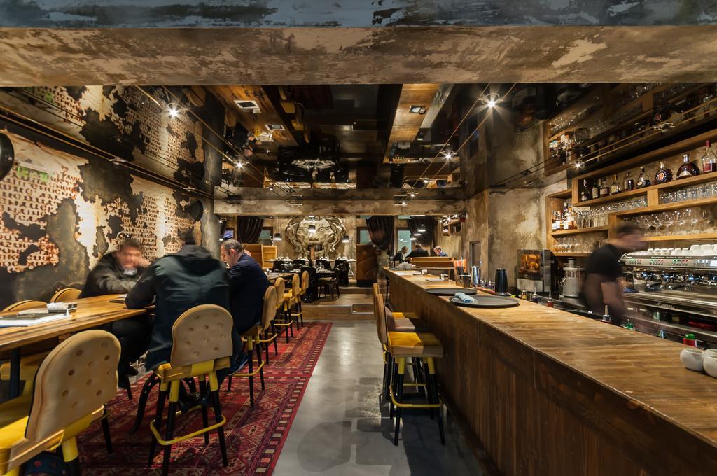 Hotel Hemera Подгорица Экстерьер фото Interior of a Starbucks Reserve store in Milan, Italy